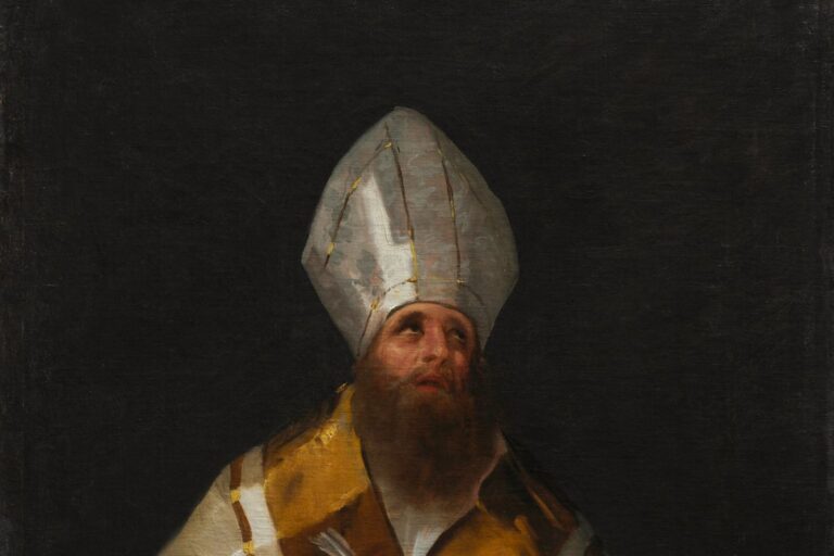 Saint Ambrose in a white mitre and golden cope, looking upward from an open book.