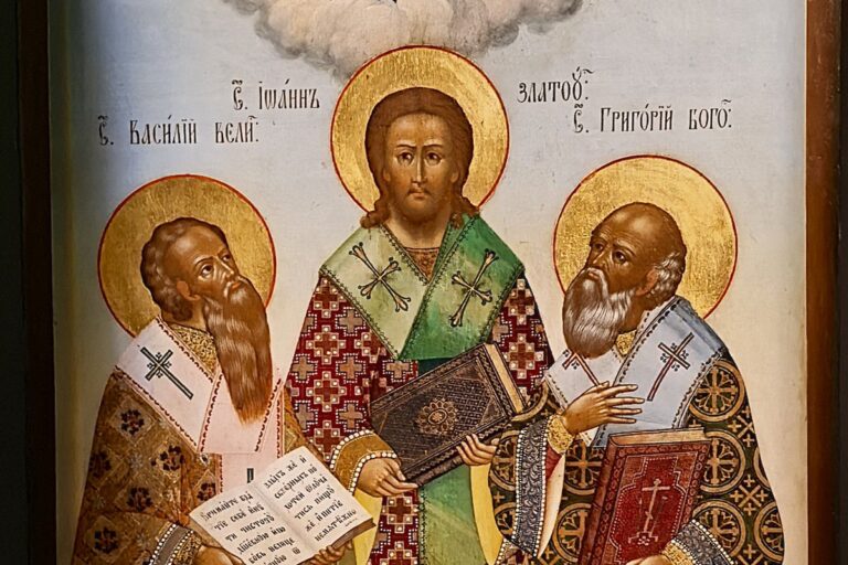 The Three Holy Hierarchs of the Greek Church standing side by side with open books, beneath Christ in the clouds.