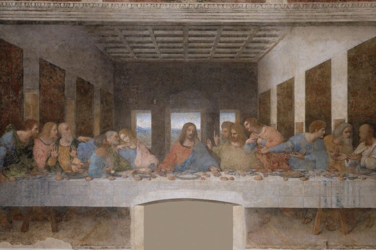 Christ at the centre of a long table, with the twelve apostles reacting to his announcement.
